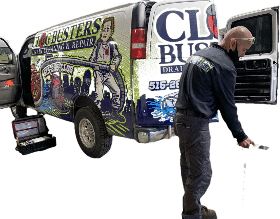 Clog Busters technician standing beside a fully stocked wrapped drain cleaning van